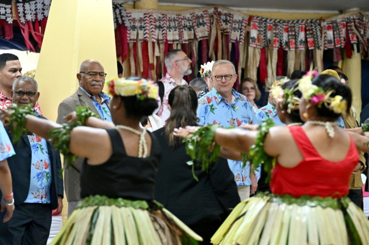 Fiji's Prime Minister Sitiveni Rabuka (L) and Australian Prime Minister Anthony Albanese (R) watch a traditional dance at the welcome ceremony of the Pacific Pre-COP31 Summit in Funafuti, Tuvalu on October 6, 2026. Over a dozen leaders touched down on the tiny Pacific atoll nation of Tuvalu on October 6 for a first-hand look at a once-vibrant ecosystem wiped out due to climate change.