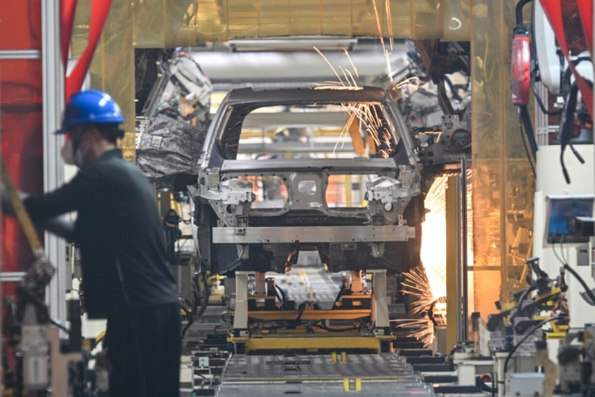 Robots weld chassis of electric cars at a Zeekr factory in Ningbo, in China's eastern Zhejiang province