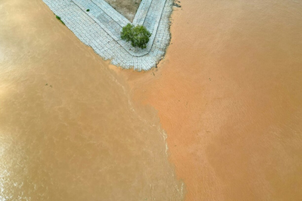 The Ruak river (L) meets with the Mekong River (R) in the Golden Triangle region, as pictured from northern Thailand's Chiang Rai province