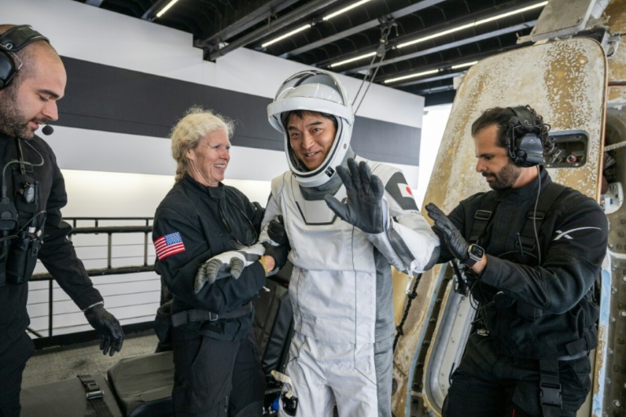 Japan Aerospace Exploration Agency (JAXA) astronaut Takuya Onishihelped out of the SpaceX Dragon capsule