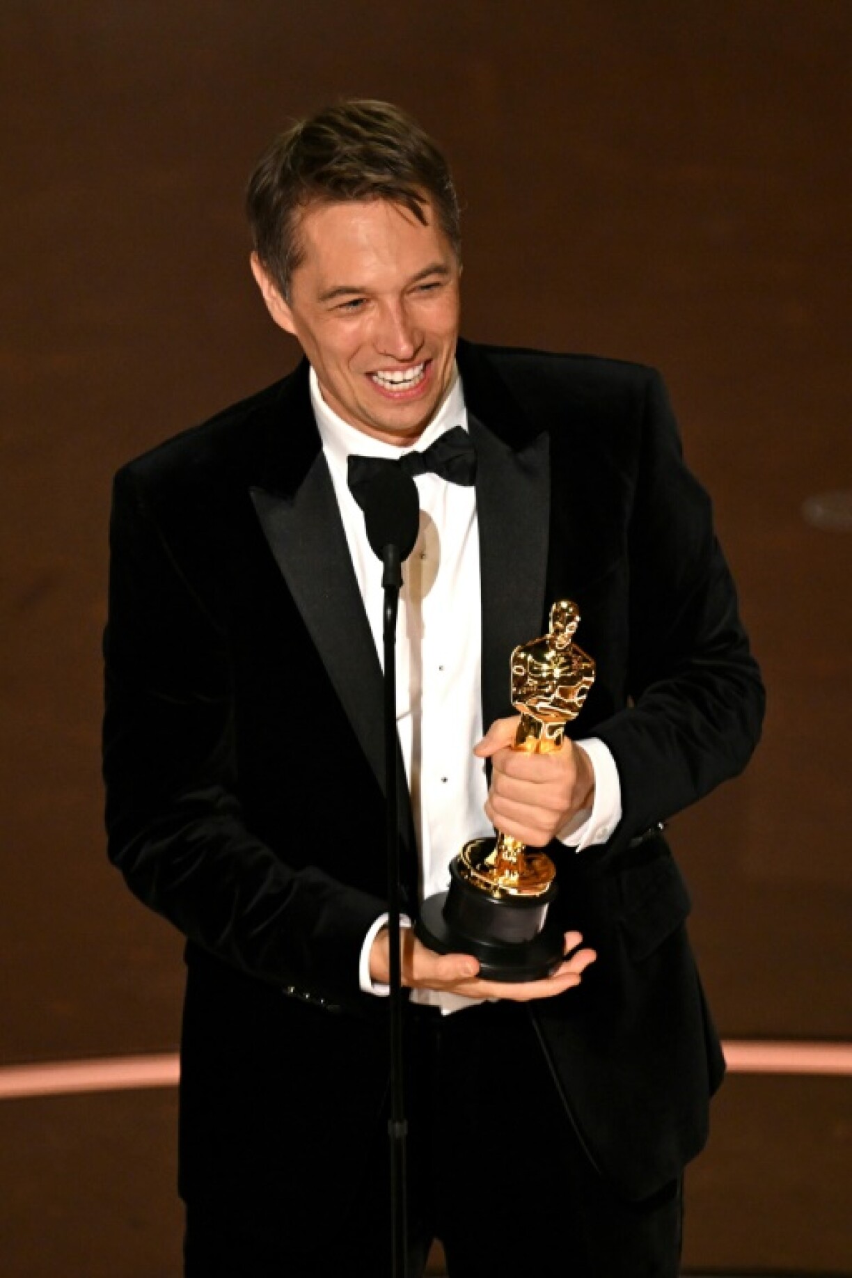 Sean Baker accepts the award for Best Director for