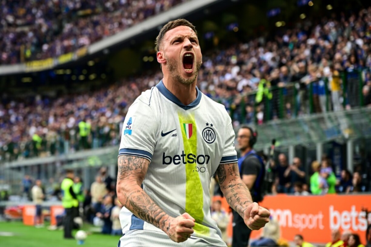 Inter Milan's Austrian forward Marko Arnautovic celebrates after scoring his team's first goal against Cagliari in the San Siro stadium