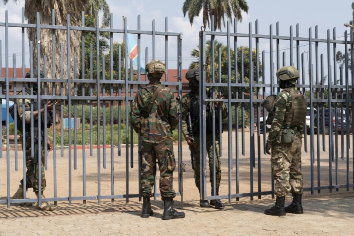Members of the M23 movement stand at the gate of the local government offices in Bukavu in this March 2025 photo