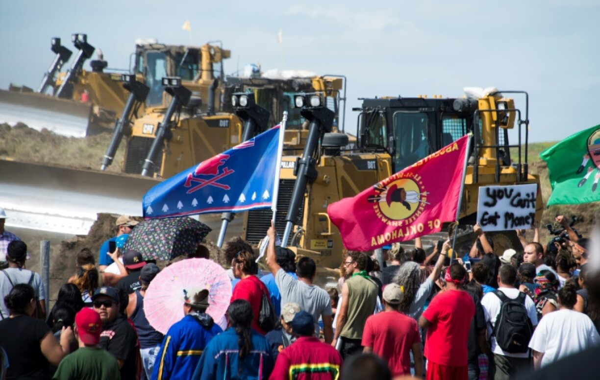 Members of the Standing Rock Sioux Tribe and their supporters opposed to the Dakota Access Pipeline (DAPL) confront bulldozers working on the new oil pipeline in an effort to make them stop on September 3, 2016, near Cannon Ball, North Dakota