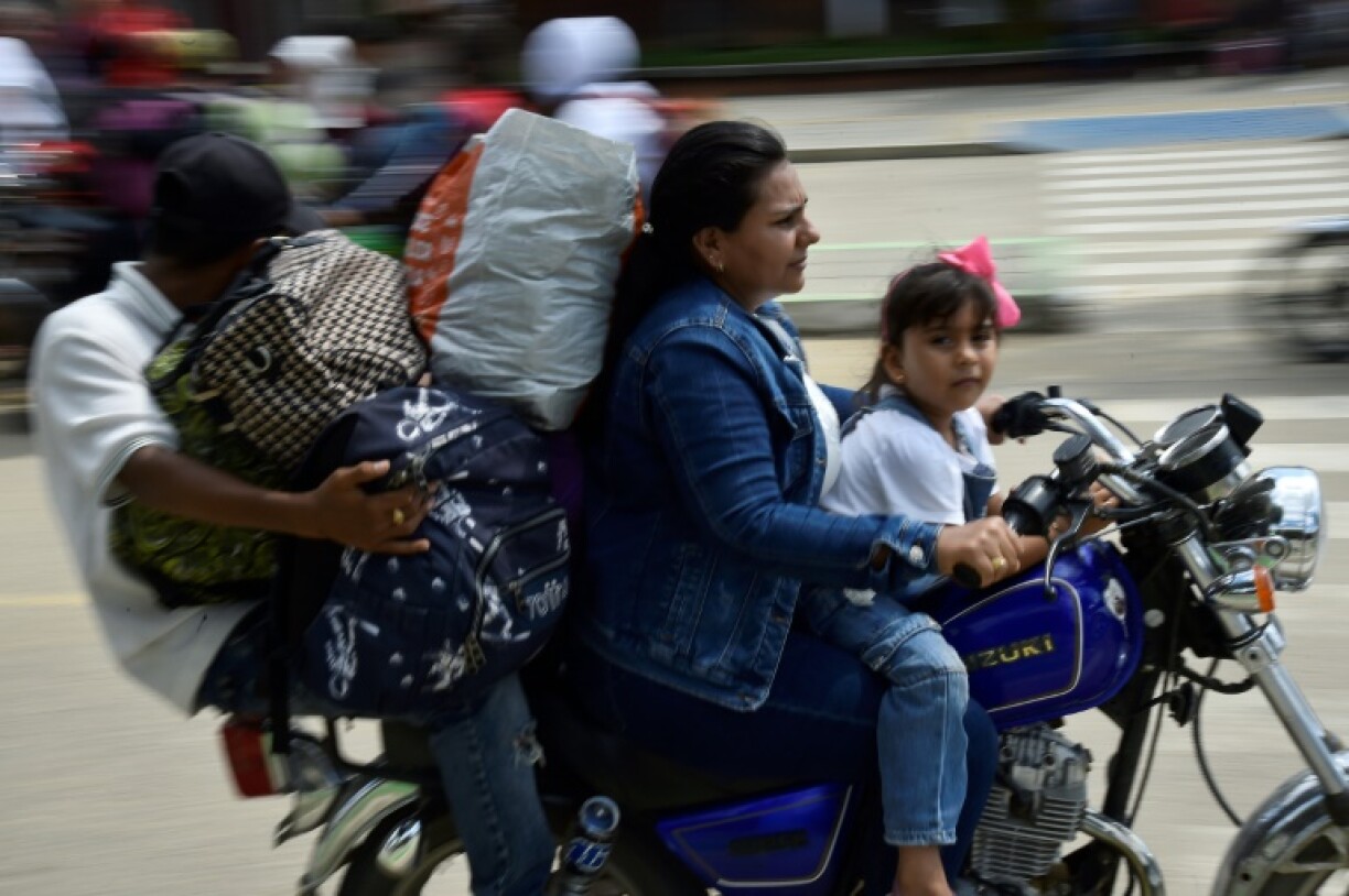 Displaced people arrived in Tibu crammed onto the backs of open trucks or on motorcycles loaded with whatever posessions they could salvage