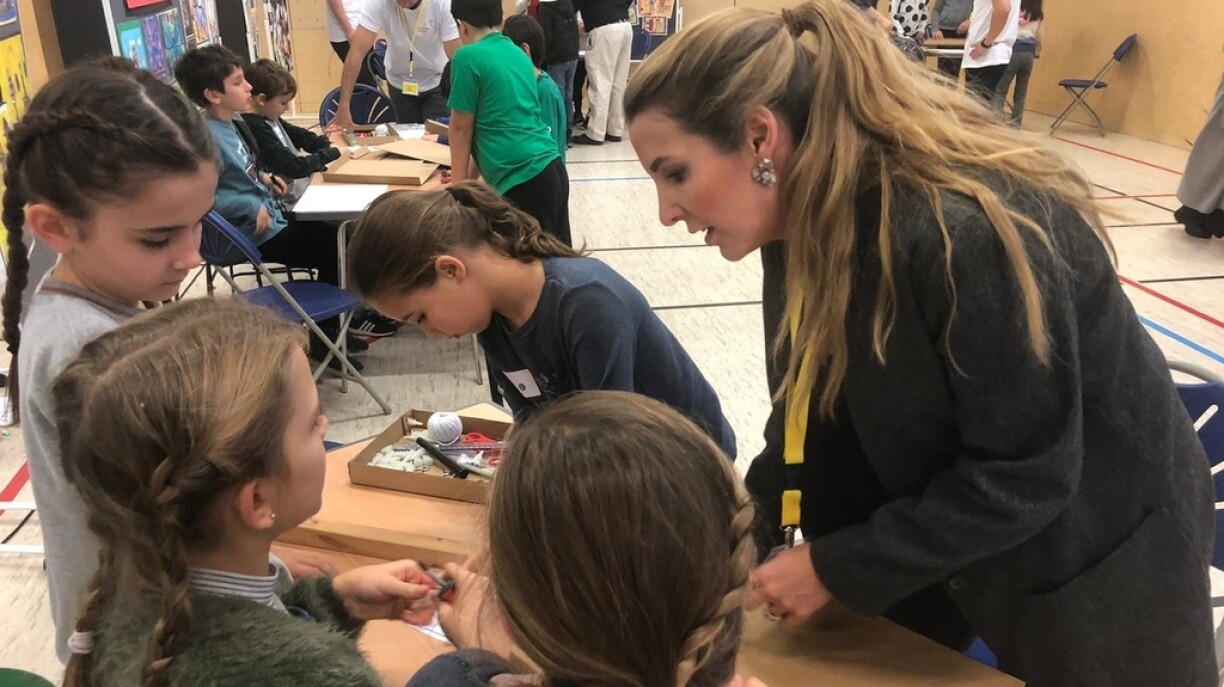 A group of children working away alongside Tessy de Nassau
