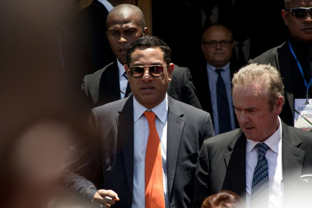 Mamy Ravatomanga (centre) is detained in Mauritius and faces money laundering accusations