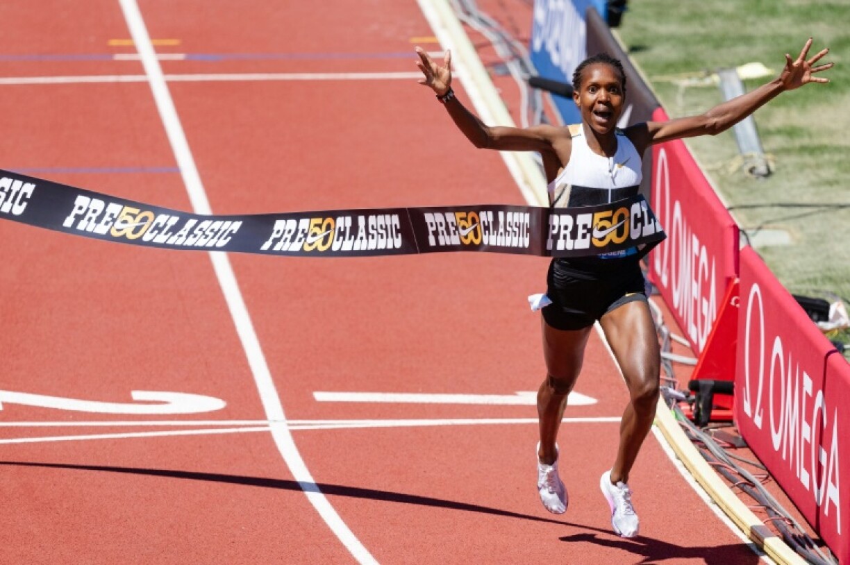Kenya's Faith Kipyegon wins the 1,500m in world record time at the Eugene Diamond League athletics meeting