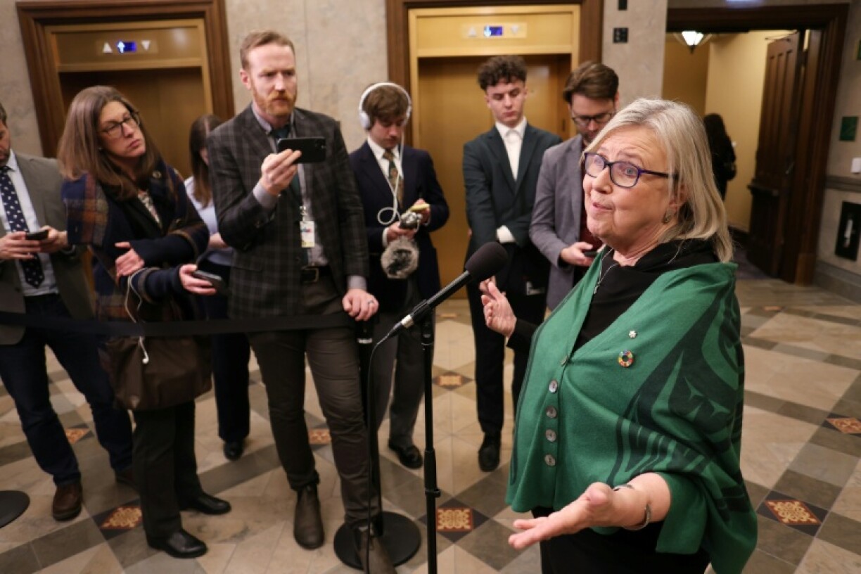 Canada's Green Party leader Elizabeth May speaks to the media while confirming she would vote with the government to pass a federal budget