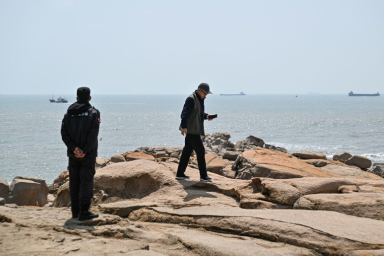 The seas around the self-ruled island have this week swarmed with Chinese warships in what Beijing has dubbed its