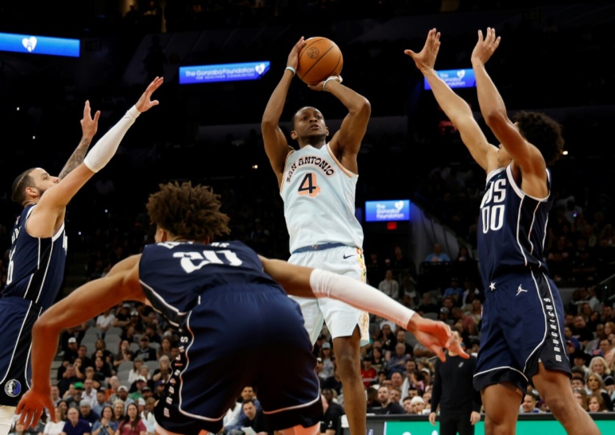 San Antonio's De'Aaron Fox, taking a shot against Dallas last season, has reportedly agreed to terms on a four-year contract extension worth $229 million