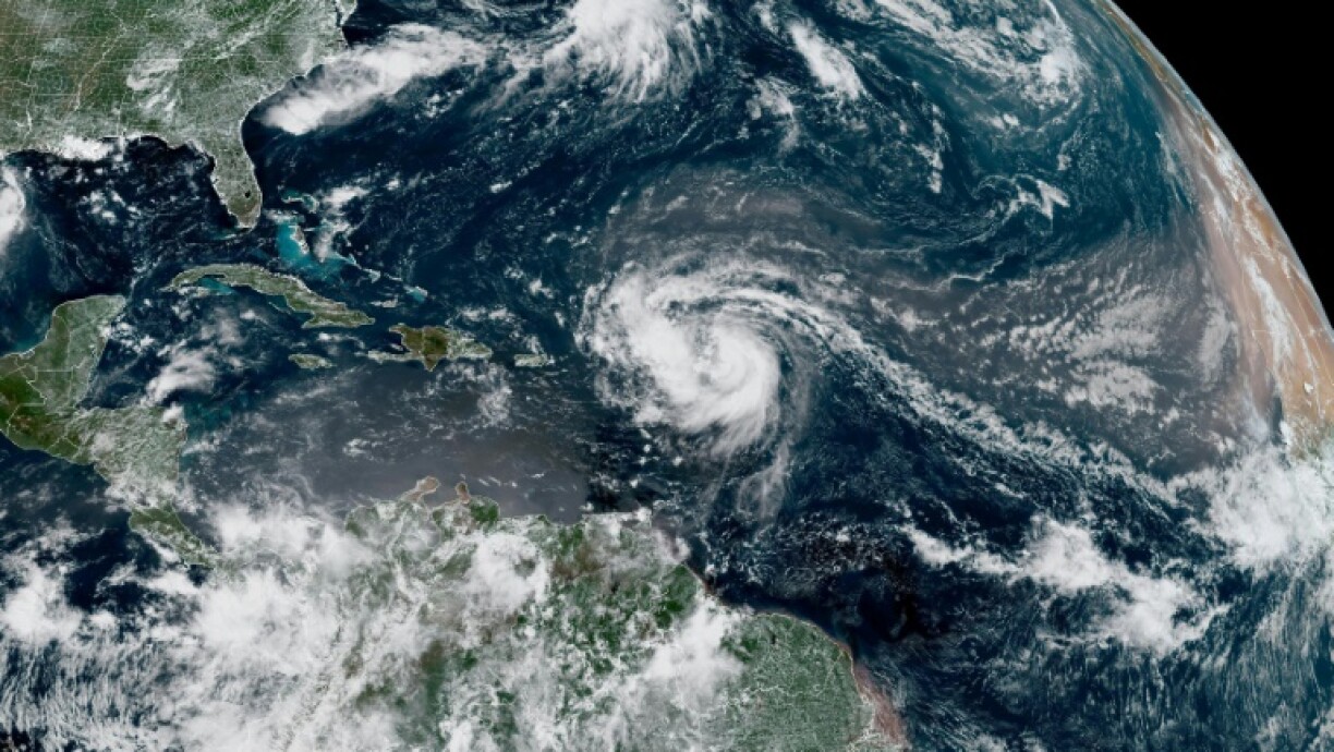 This satellite image provided by the National Oceanic and Atmospheric Administration shows Hurricane Erin forming in the Atlantic Ocean