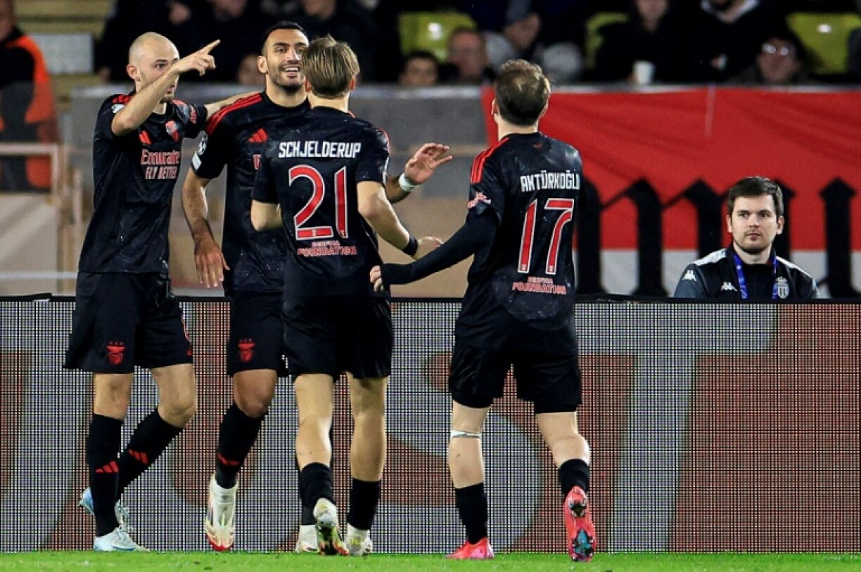 Vangelis Pavlidis (2L) celebrates with teammates after scoring for Benfica against Monaco