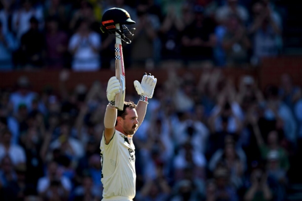 Australia's Travis Head celebrates after scoring a century on the second day of the second Test against India