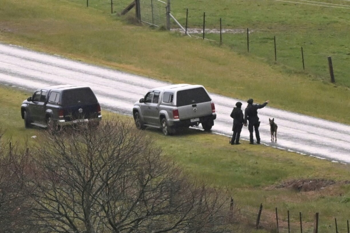 Hundreds of police are searching for an Australian gunman accused of killing two officers