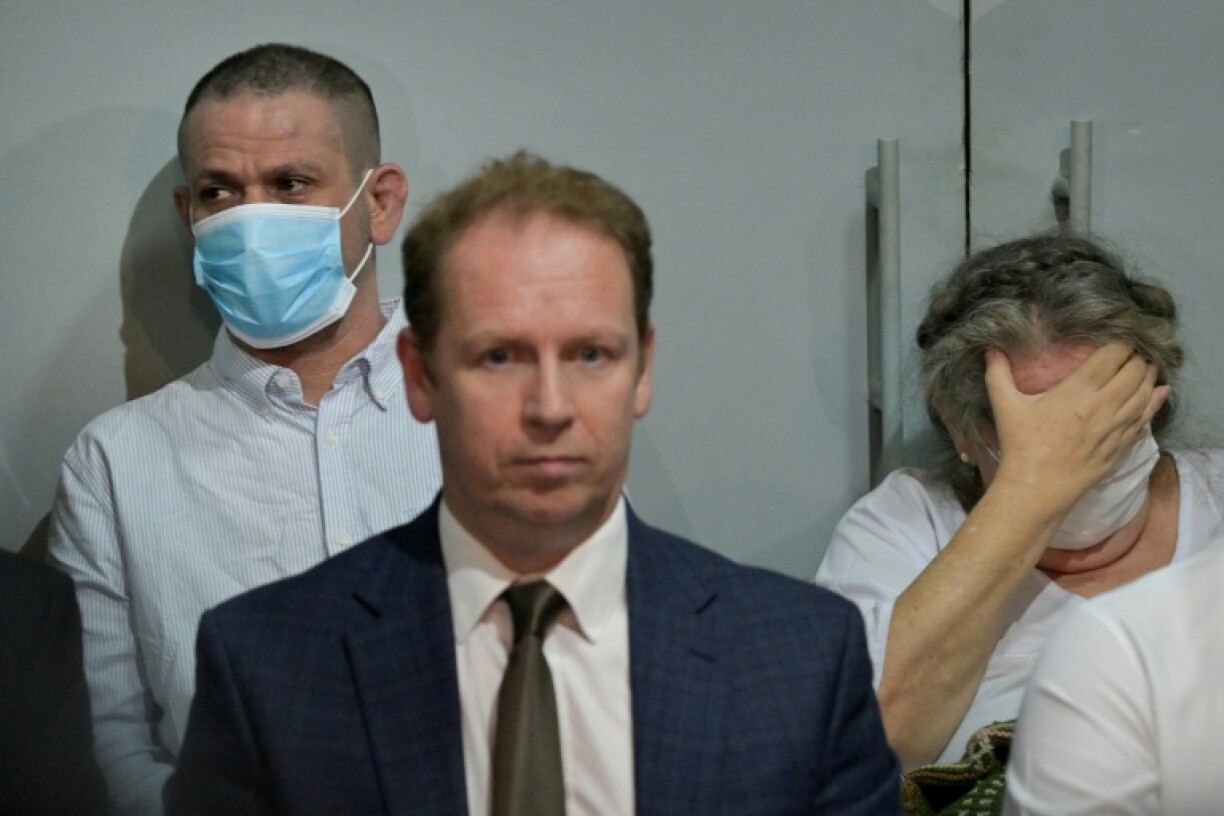 British death row inmates Lindsay Sandiford (R) and Shahab Shahabadi (L) attend a press conference before being repatriated under an agreement between Indonesia and the UK, at Kerobokan Prison on the resort island of Bali