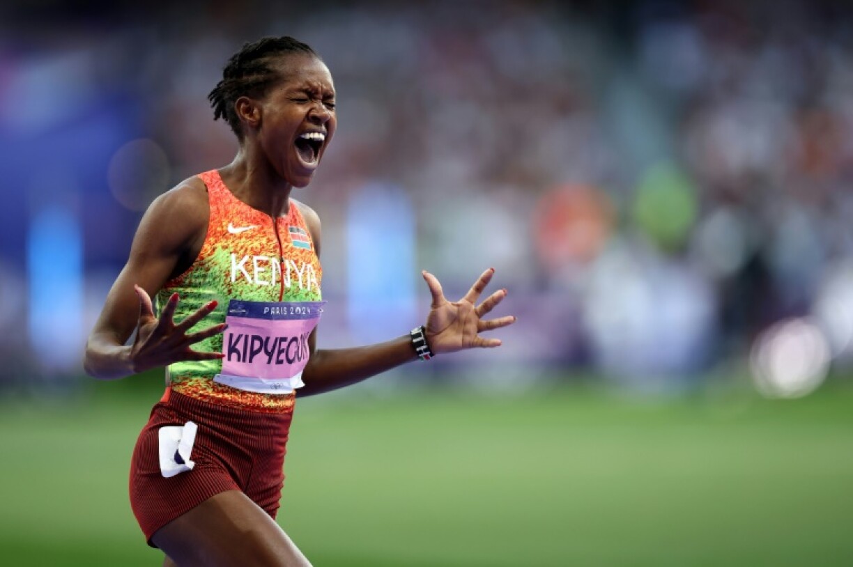 Kenya's Faith Kipyegon reacts as she wins the 1,500m at the Paris Olympics