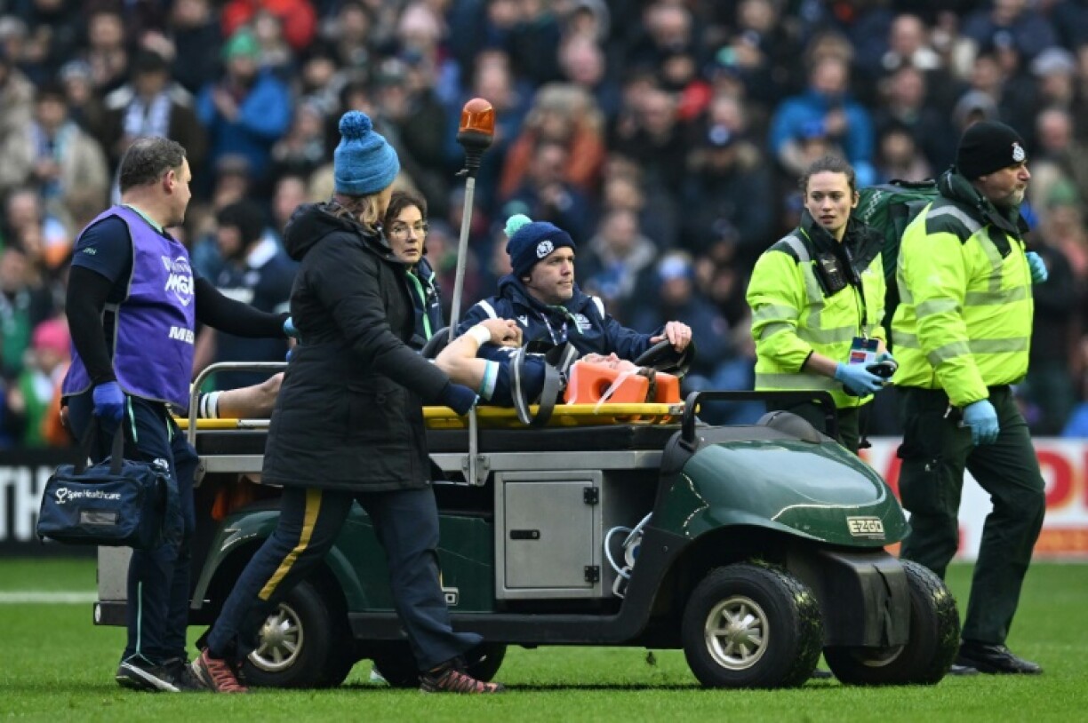 Scotland wing Darcy Graham is taken from the field on a stretcher