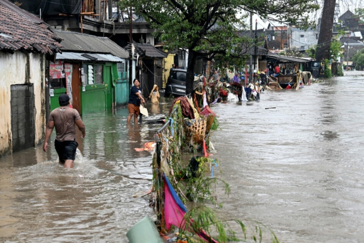 Flash floods following heavy rain hit two islands in Indonesia, including tourist hotspot Bali, killing at least 13 people