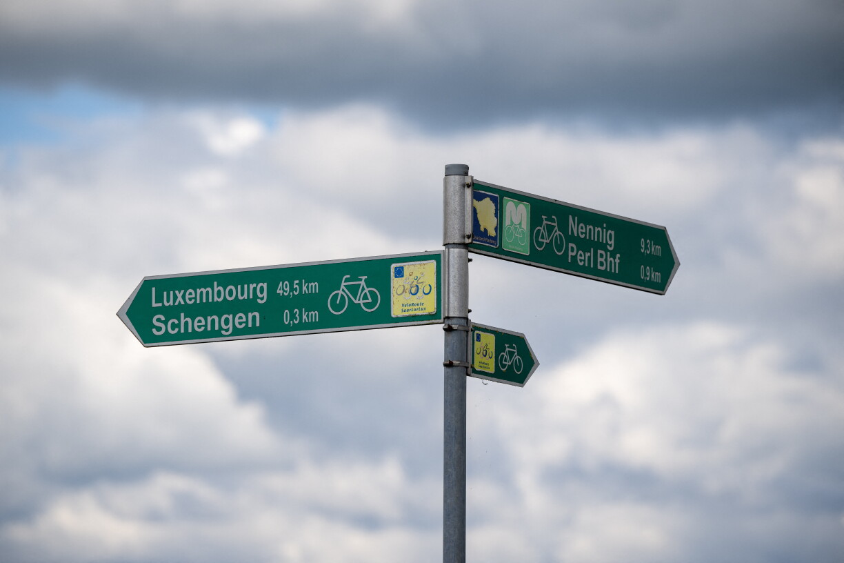 Signs for cyclists on the Moselle bridge between Perl (Germany) and Schengen (Luxembourg), 13 September 2024.