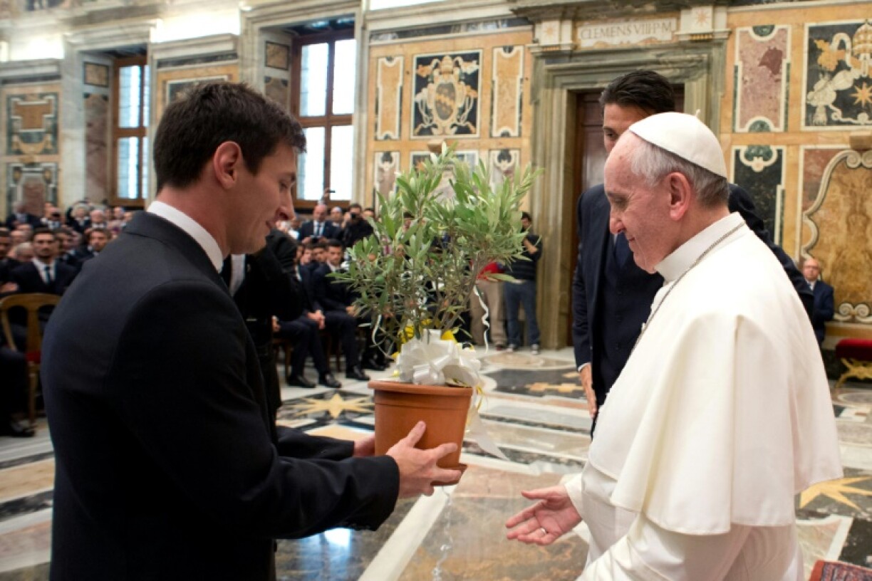 Lionel Messi presents Pope Francis with an olive tree on a visit to the Vatican in 2013
