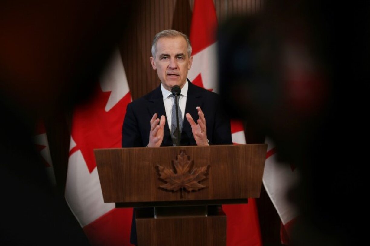 Canada's Prime Minister Mark Carney speaks to the media after meeting with his cabinet to deal with the US auto tariffs on March 27, 2025