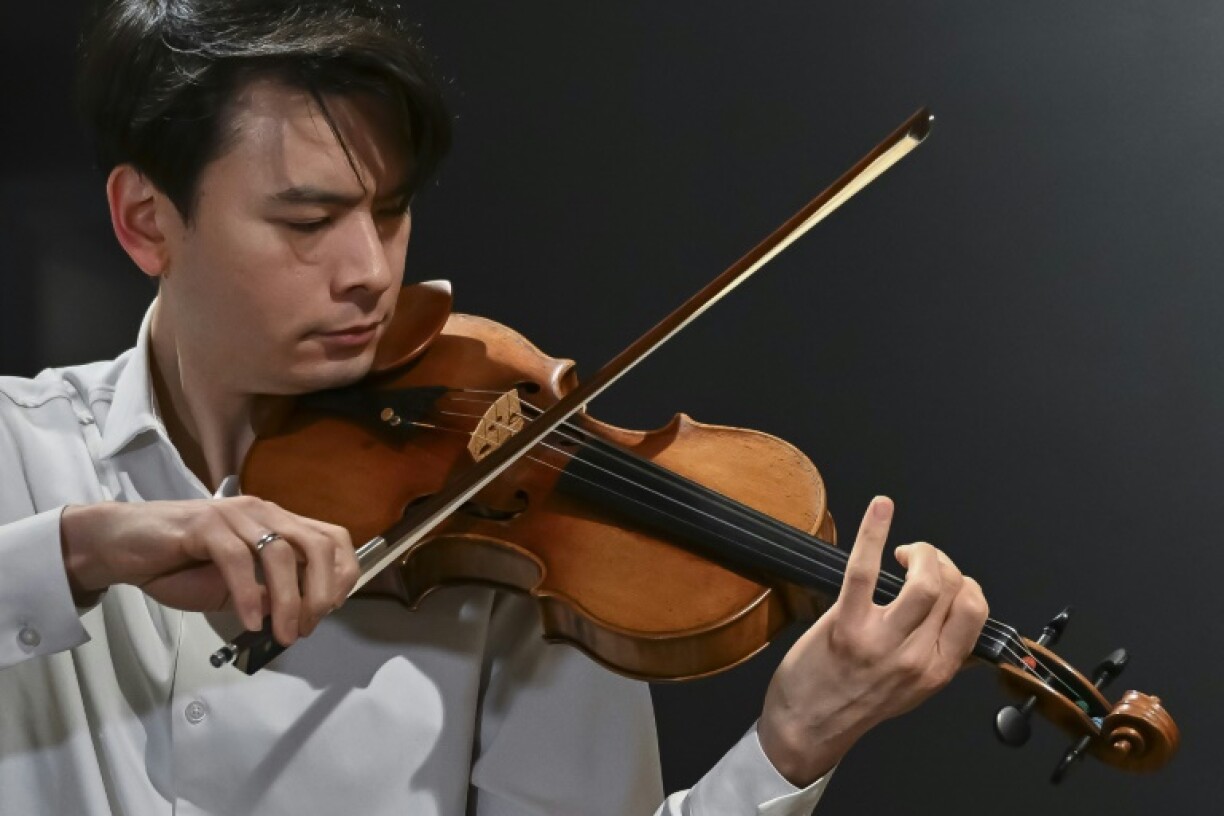 Classical US violinist Stefan Jackiw plays the Joachim-Ma Stradivarius violin during a preview of the violin's auction at Sotheby's in New York City on February 3, 2025