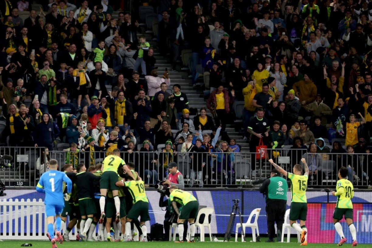Australia celebrate their goal against Japan
