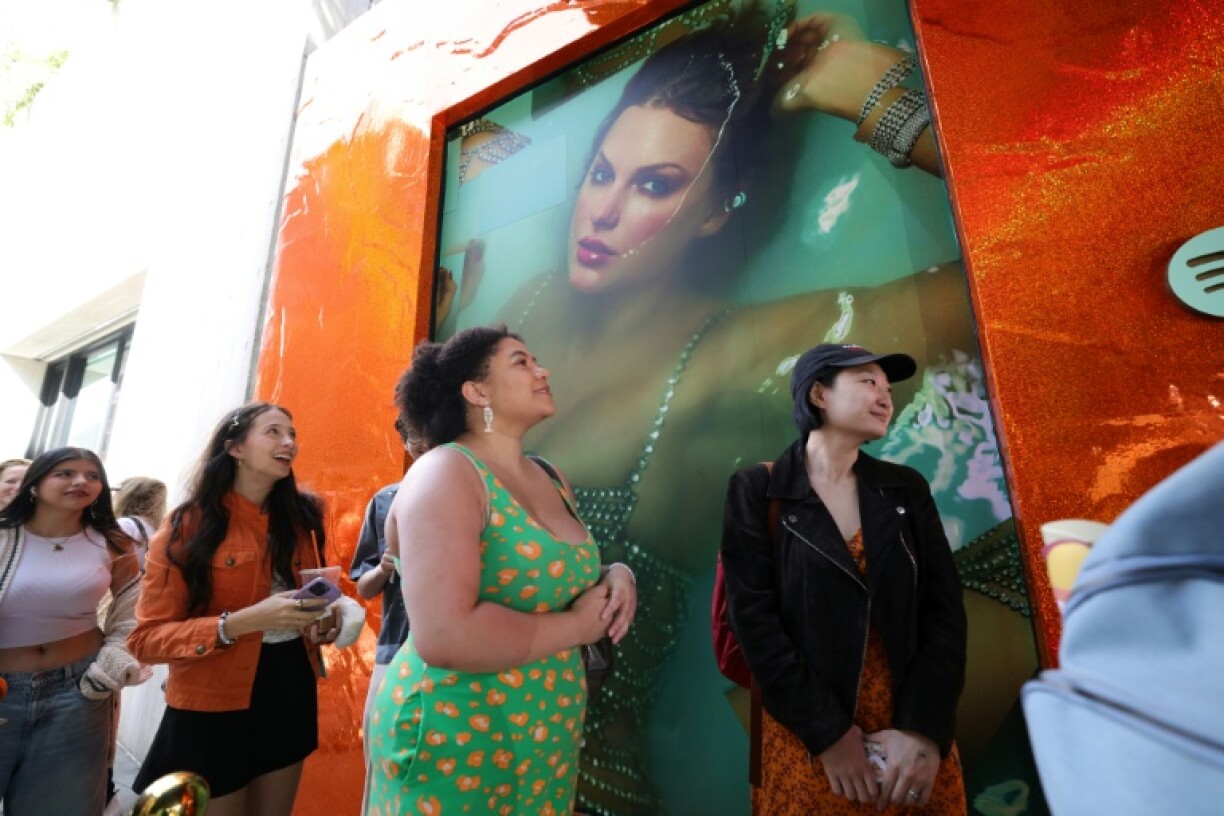 Fans of Taylor Swift wait in line to attend a pop-up event in New York to celebrate the release of 'The Life of a Showgirl'