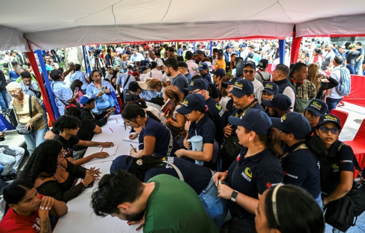 Thousands line up to join the civilian militia in Venezuela after President Nicolas Maduro warned of possible US invasion