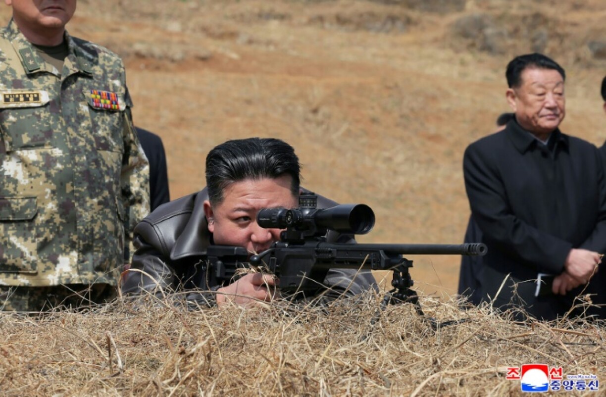 Images released by state media showed Kim peering through the scope of a sniper rifle on a visit to special forces