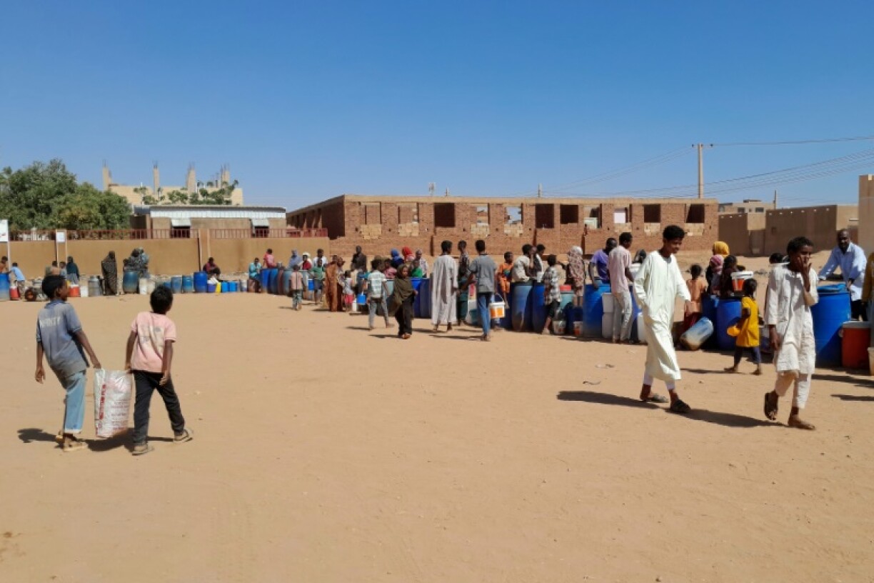 Sudanese queue for water in Omdurman, part of the greater Khartoum area where Sudan's army and the paramilitary Rapid Support Forces are fighting a protracted struggle for control