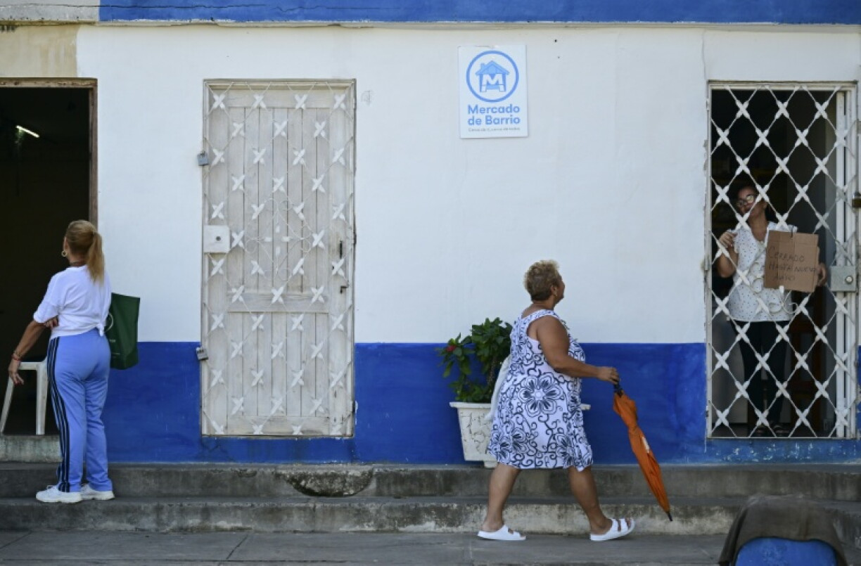 Women outside one of Havana's new 'neighborhood markets' where basic food and hygiene products are available to the most vulnerable citizens at a slight discount on market rates