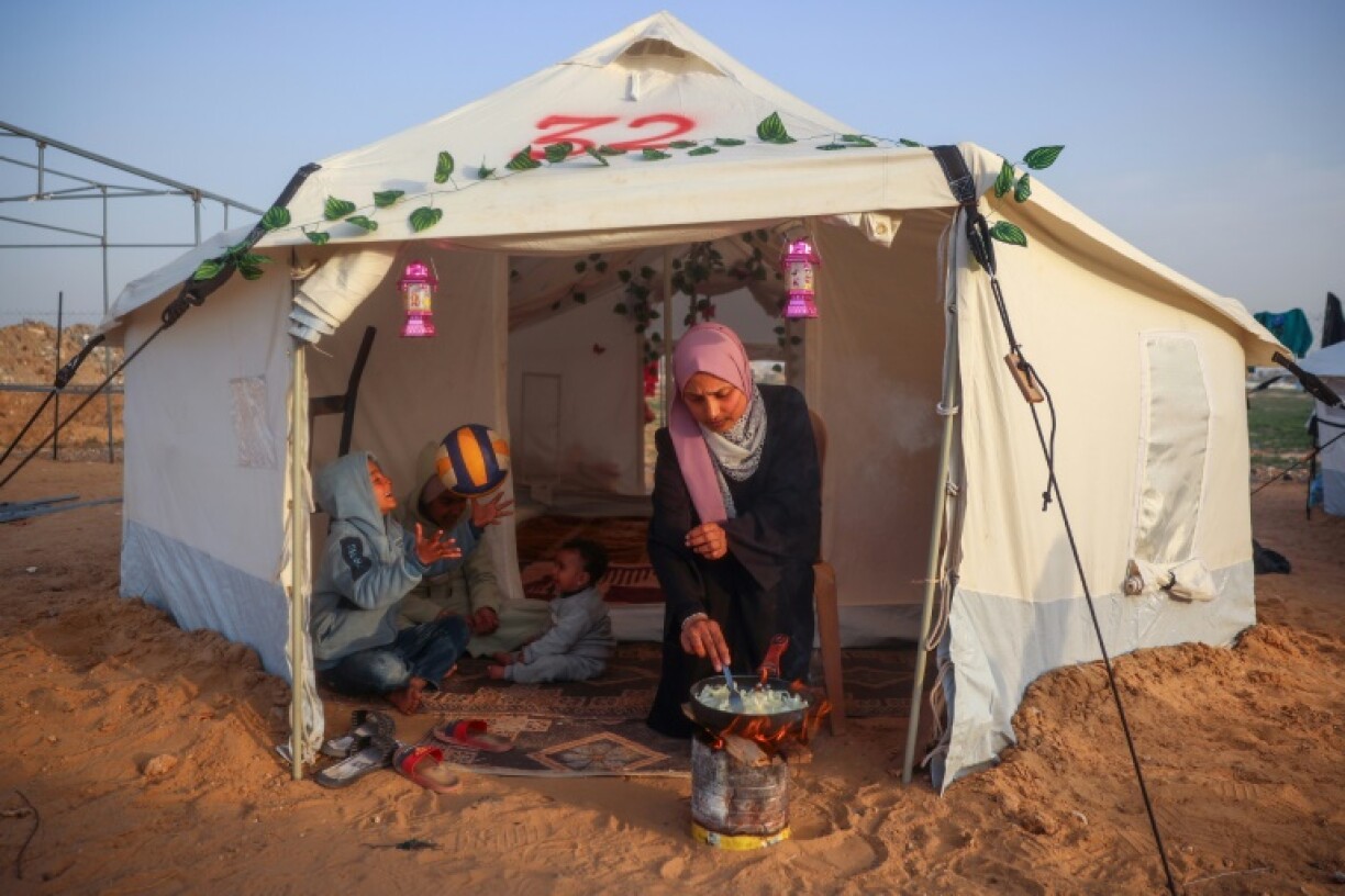 A Palestinian woman in the Bureij refugee camp in the central Gaza Strip cooks a meal ahead of iftar