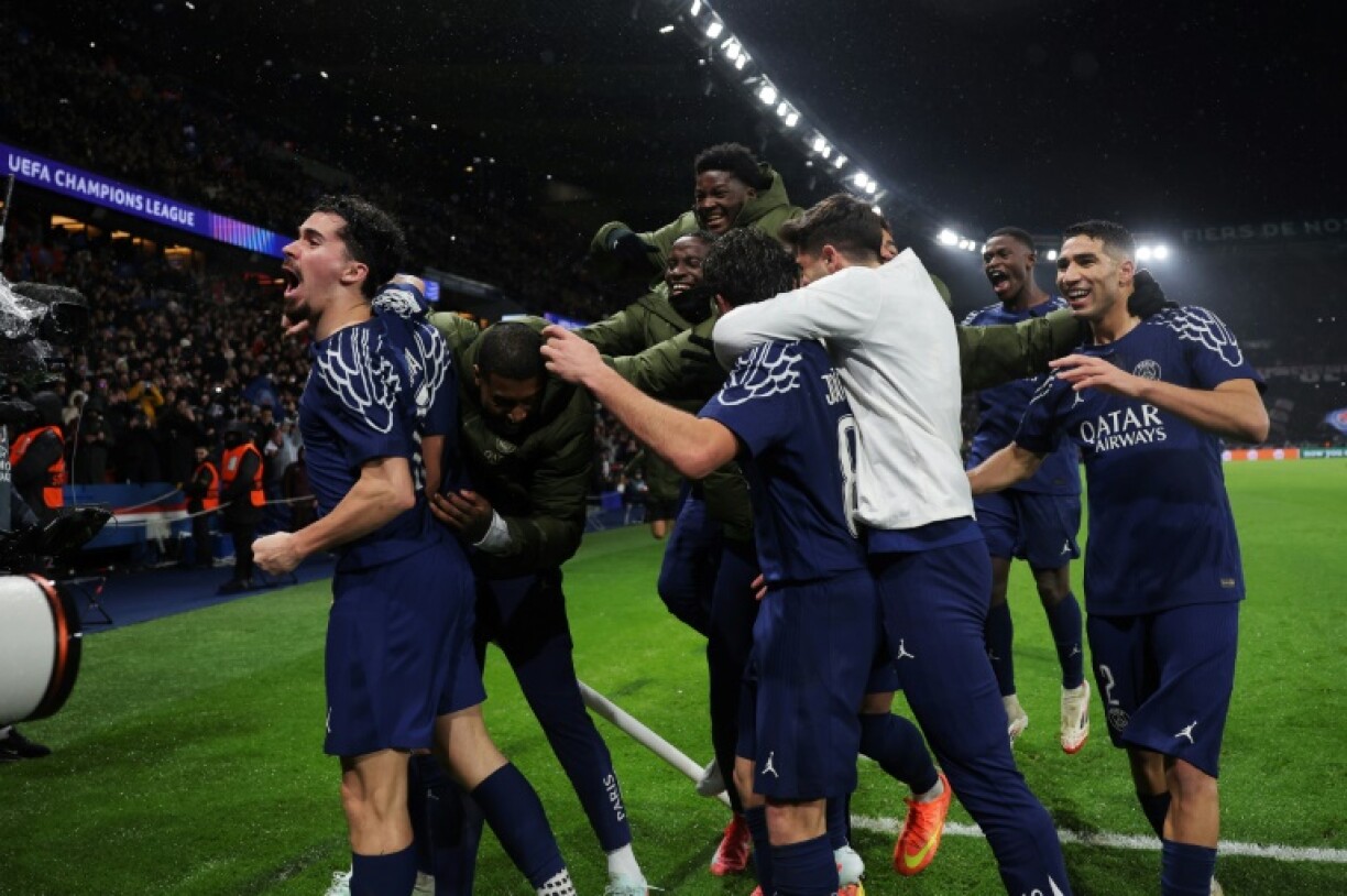 Paris Saint-Germain players celebrate coming from behind to beat Manchester City in the Champions League on Wednesday