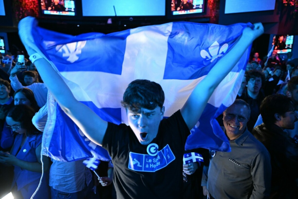 Supporters of the separatist Parti Quebecois celebrate results in Canada's provincial election