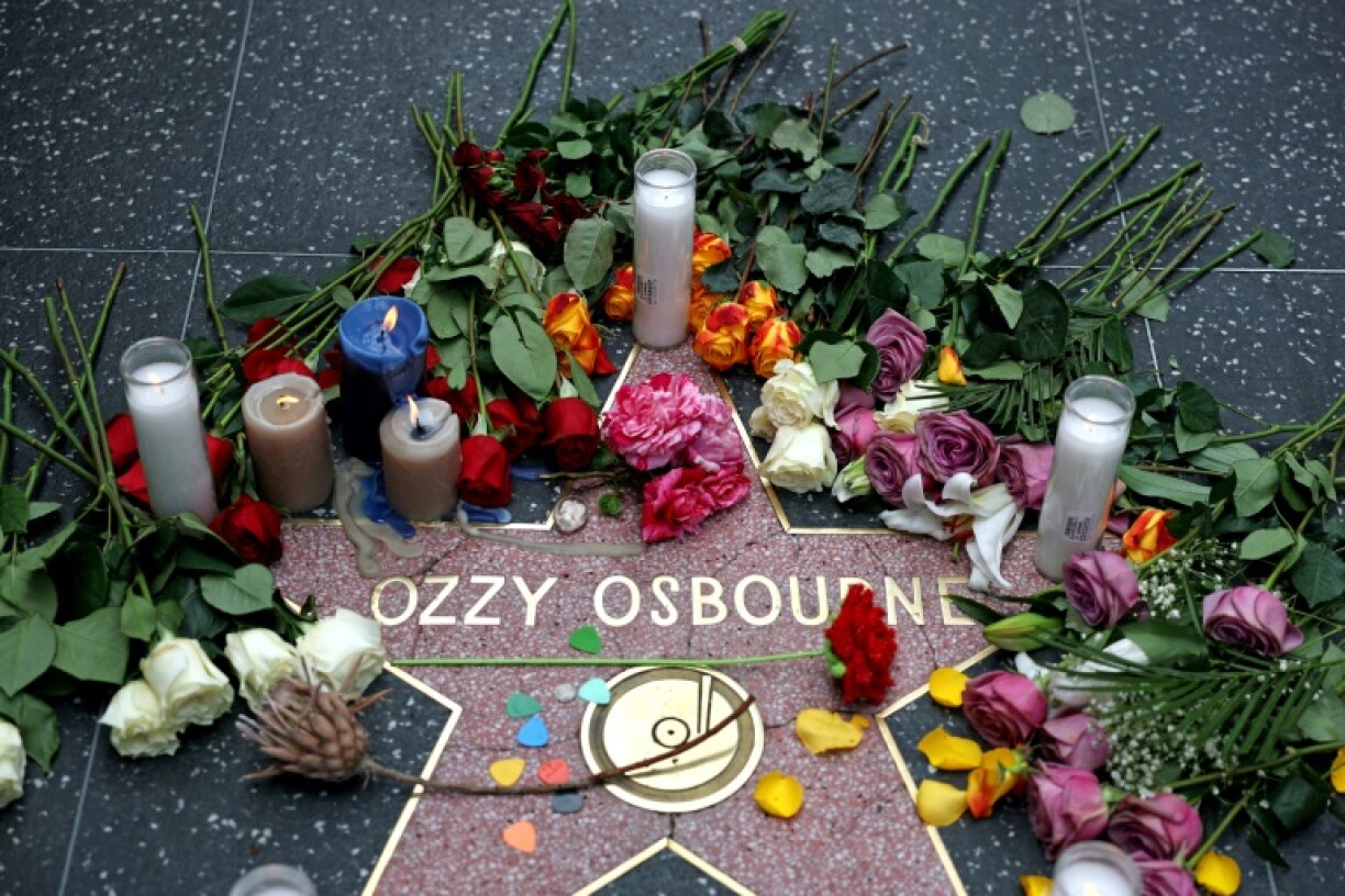 Flowers are left at a makeshift memorial at Ozzy Osbourne's Star on the Hollywood Walk of Fame