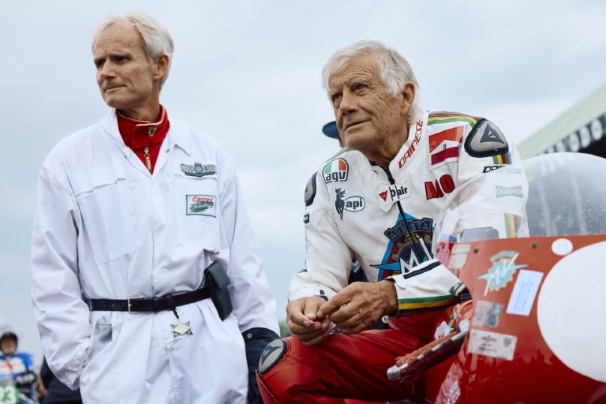 Italian MotoGP legend Giacomo Agostini (R) told AFP seven-time champion Marc Marquez may break his record of eight