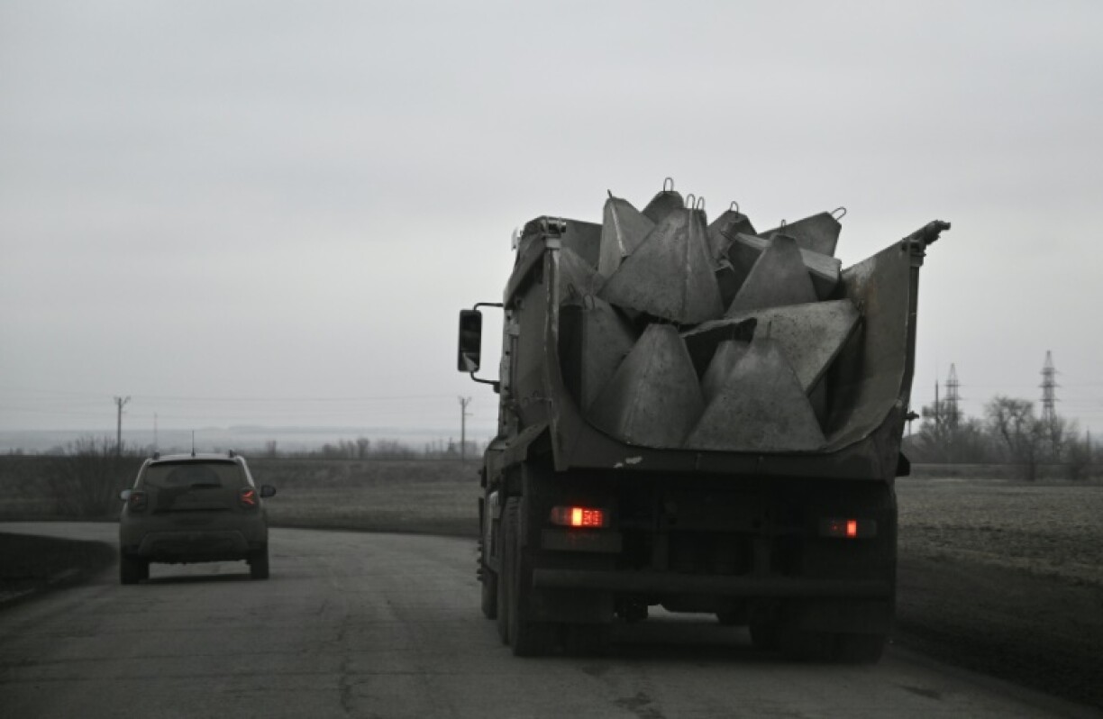 A truck carries concrete obstacles, known as dragon's teeth, in the Dnipropetrovsk region