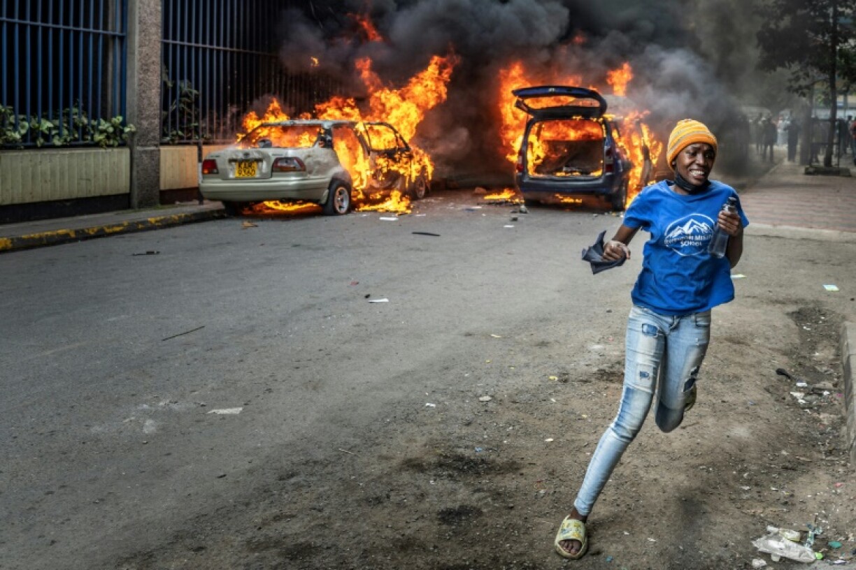 Protesters marched on parliament on Thursday, some throwing stones and police firing tear gas