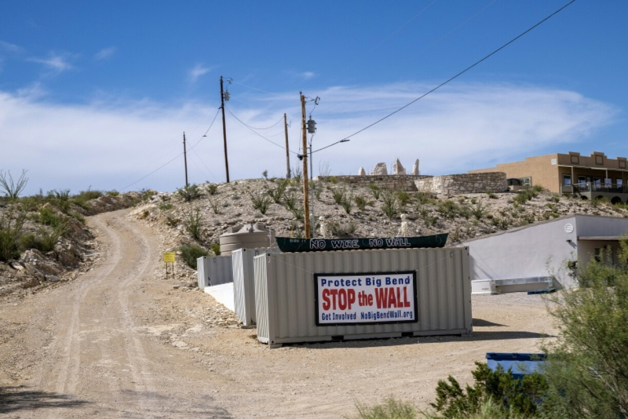 A protest sign is seen on a state road that leads into Big Bend National Park in southern Texas, on August 15, 2026