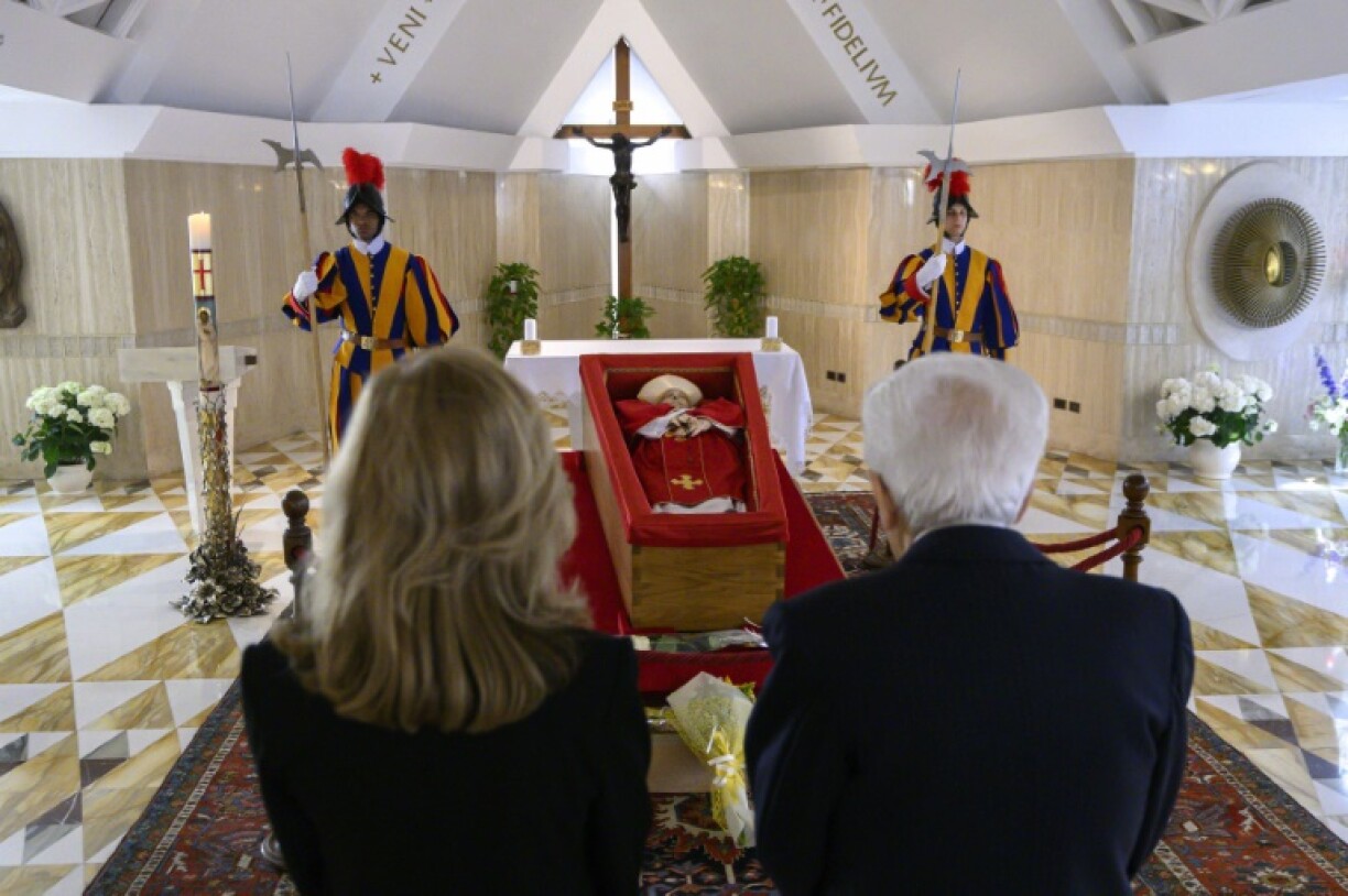Italy's President Sergio Mattarella and his daughter Laura pay respects in front of the coffin of the late Pope Francis in the Chapel of Santa Marta in The Vatican