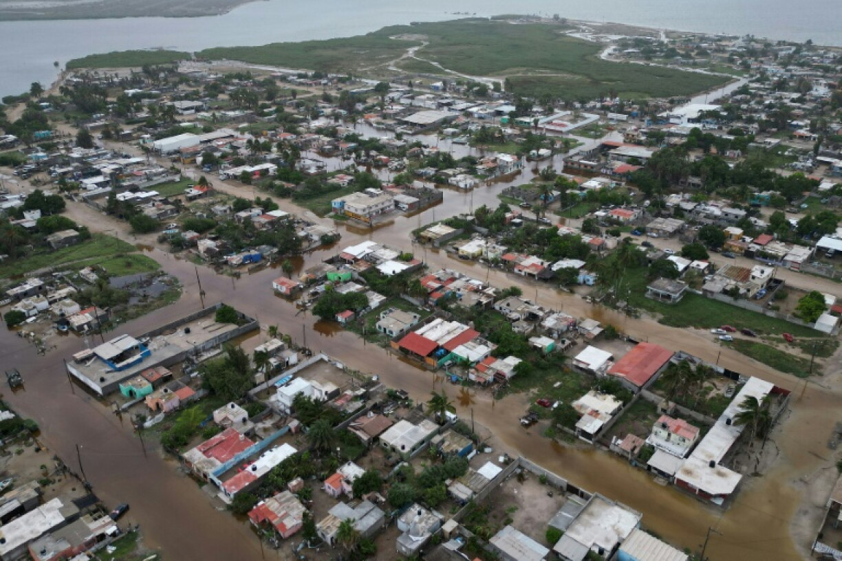 Floodwaters inundated Puerto San Carlos and other towns along Mexico's Pacific coast on Baja California peninsula with the arrival of Hurricane Polo