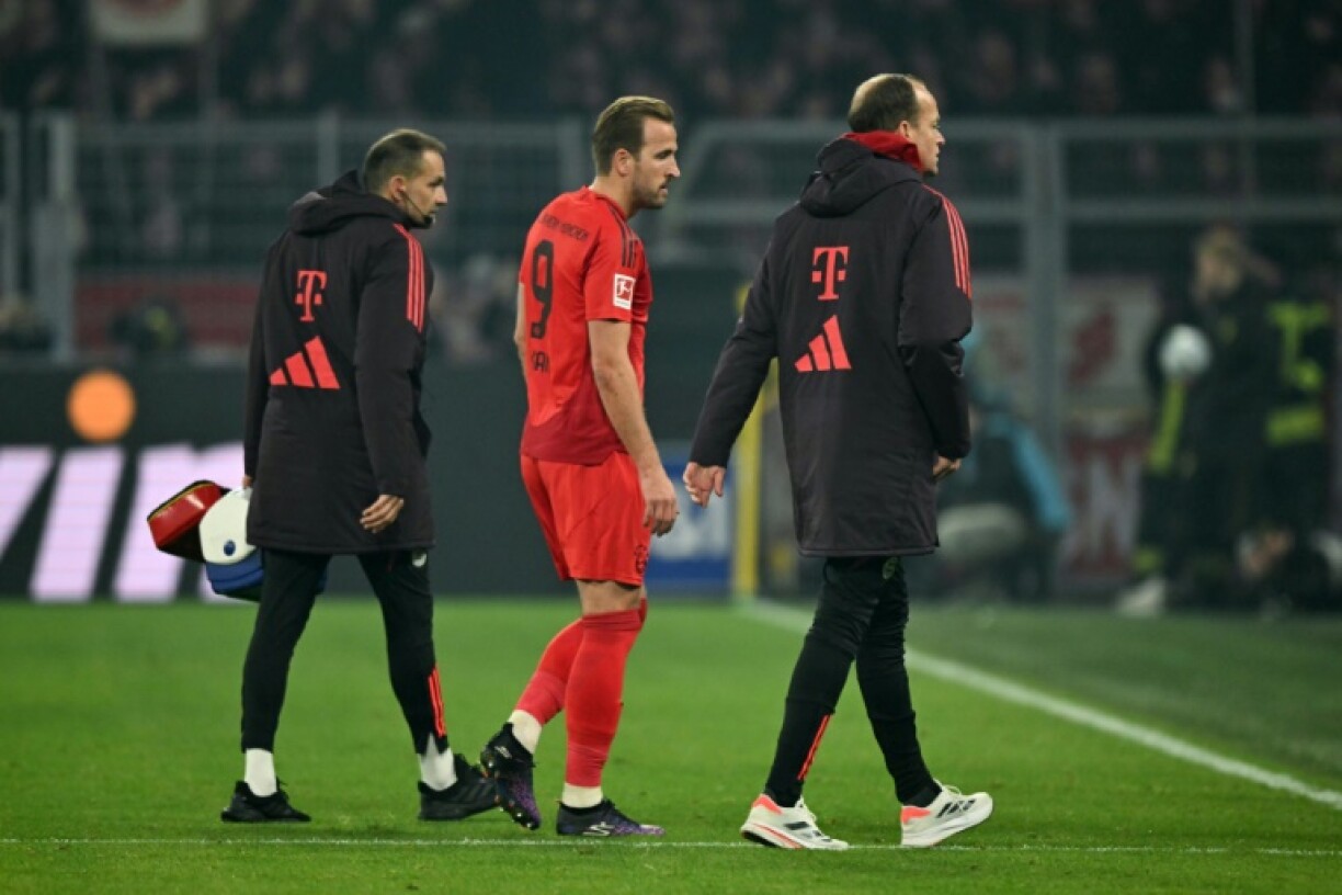 Bayern Munich's English forward Harry Kane (C) suffered a hamstring injury during Saturday's 1-1 Bundesliga draw at Borussia Dortmund