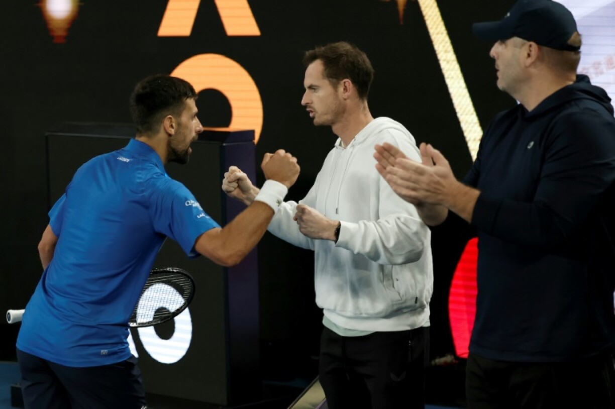 Novak Djokovic (L) celebrates with his coach Andy Murray (C)