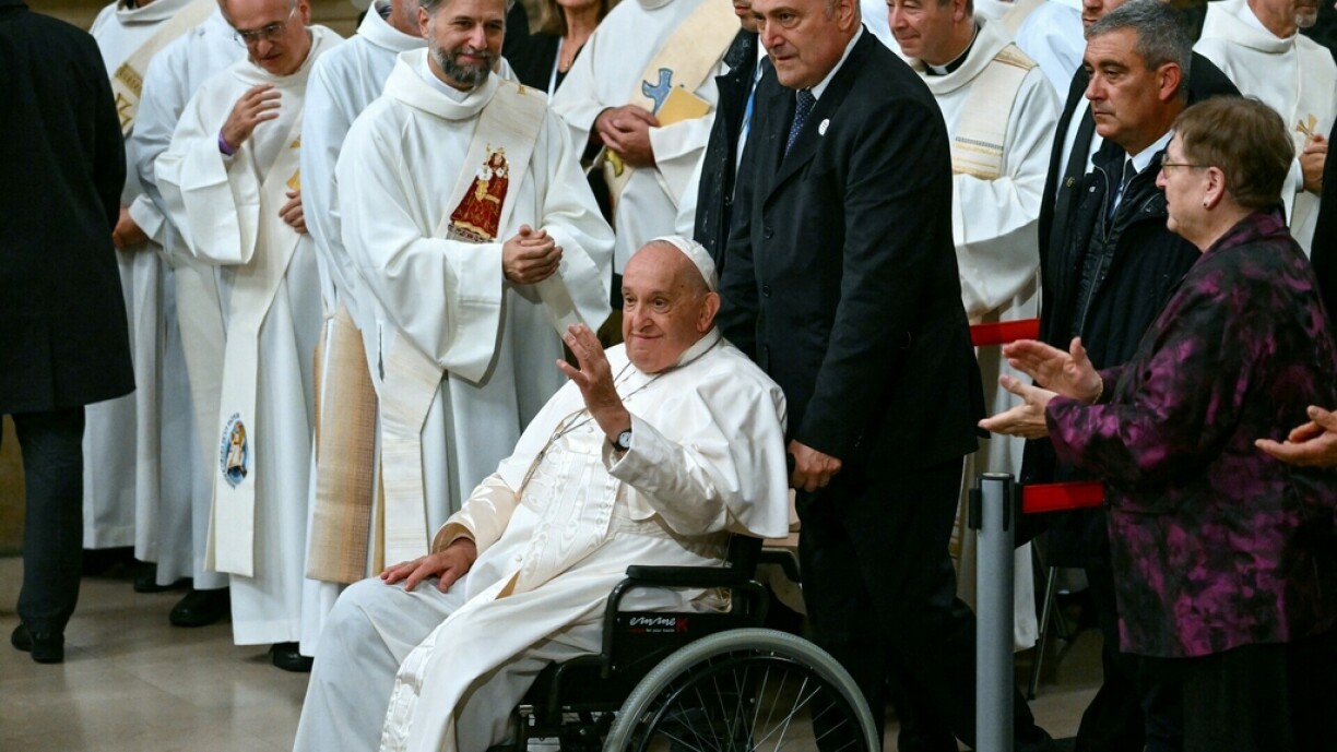 Pope Francis waves to attendees as he arrives for a meeting with the Catholic community at the Notre-Dame Cathedral in Luxembourg City on 26 September 2024.