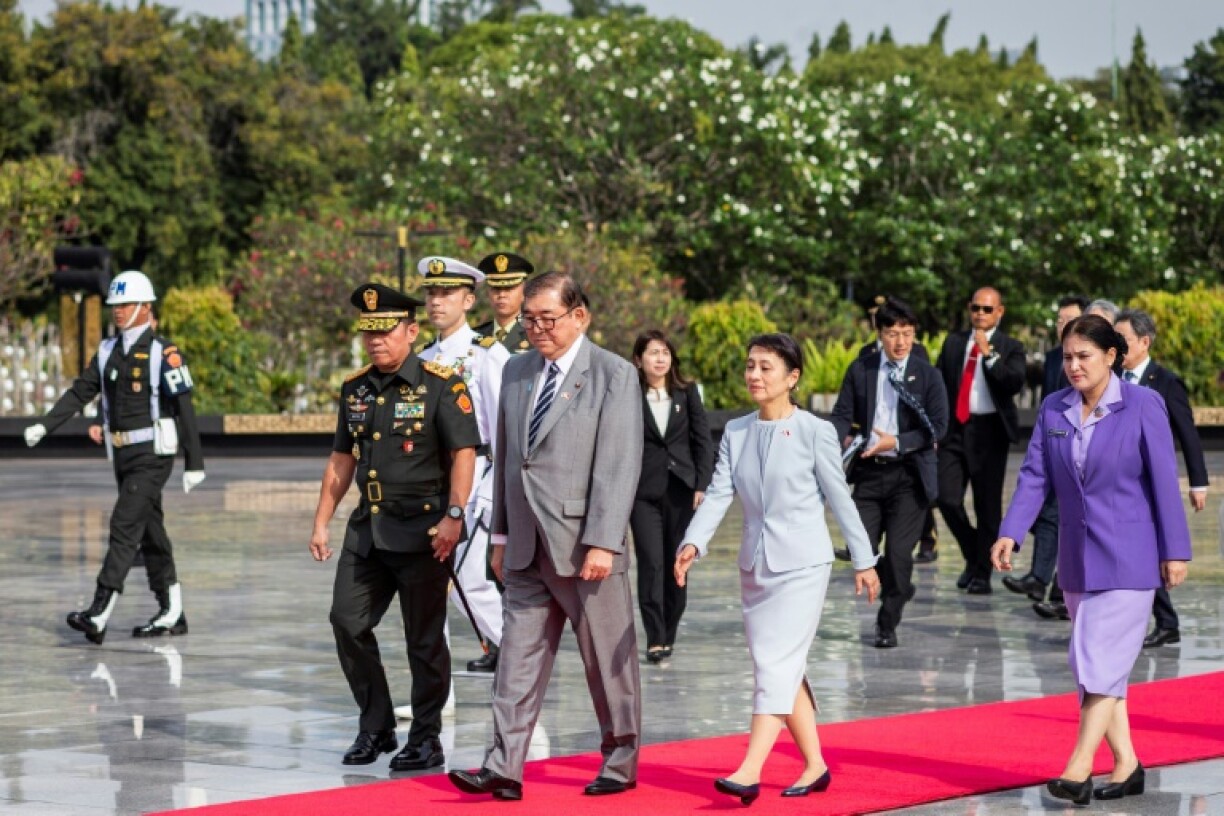Japan's Prime Minister Shigeru Ishiba and his wife Yoshiko Nakamura attend a ceremony in Jakarta