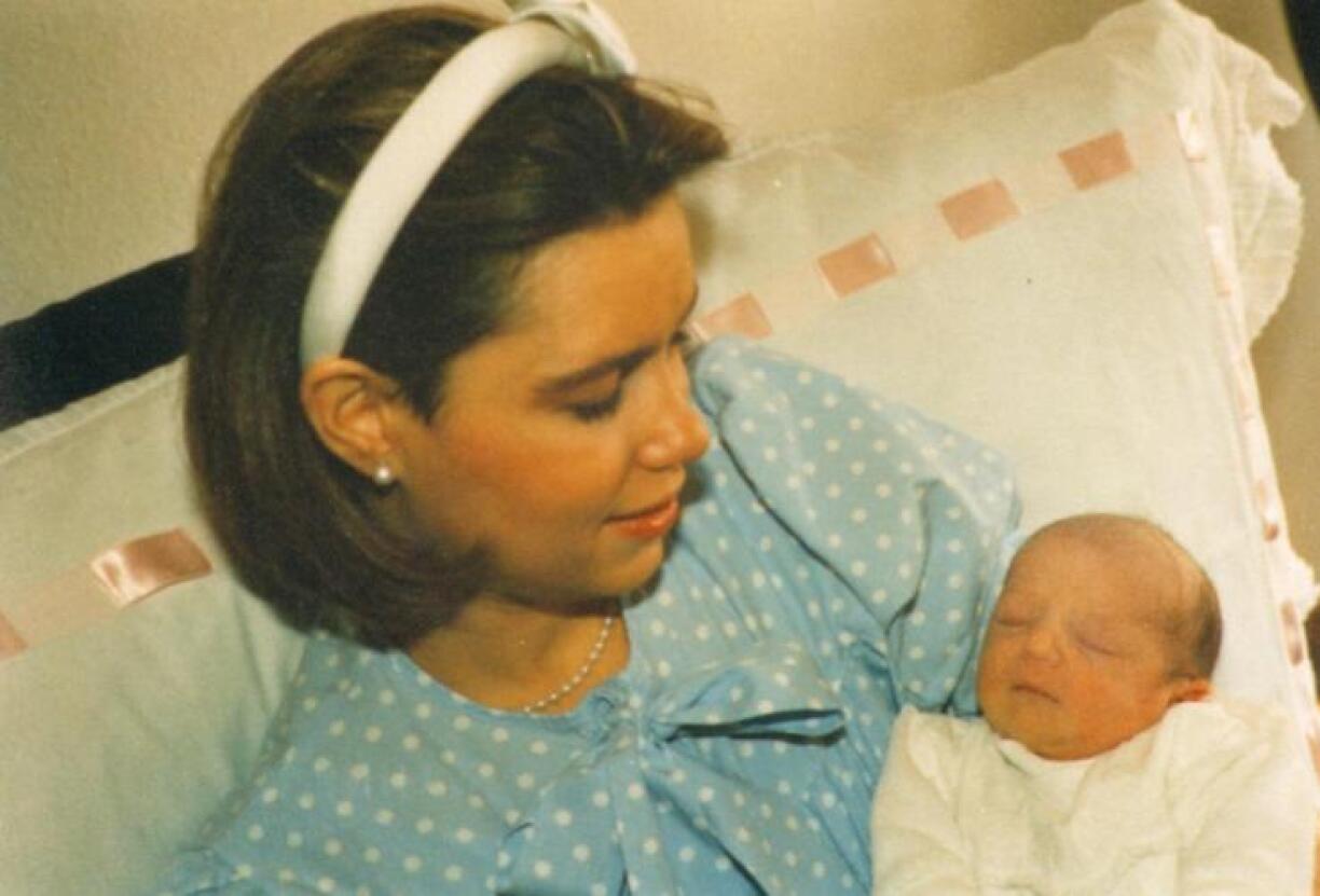 A newborn Princess Alexandra held by her mother Grand Duchess Maria Teresa in 1991.