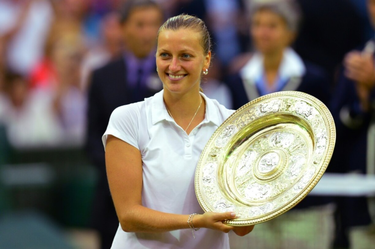 Czech Republic's Petra Kvitova holds the Wimbledon winner's trophy in 2014