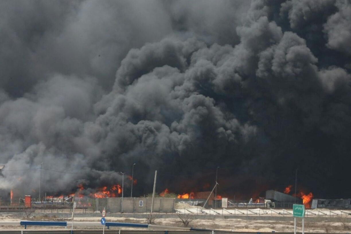 Thick black smoke still billows two days after a deadly blast at Iran's Shahid Rajaee Port, in a photo provided by the Iranian Red Crescent